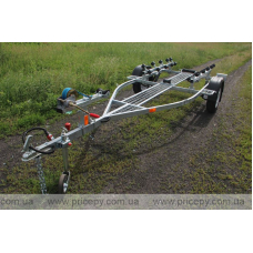 Trailer for transporting rubber RIB boats up to 3.8 m with roller bunks