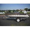 Trailer for transporting rubber RIB boats up to 3.8 m with roller bunks