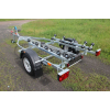 Trailer for transporting rubber RIB boats up to 3.8 m with roller bunks