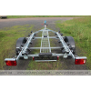 Trailer for transporting rubber RIB boats up to 3.8 m with roller bunks