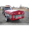 A trailer with the possibility of transporting an inflatable boat